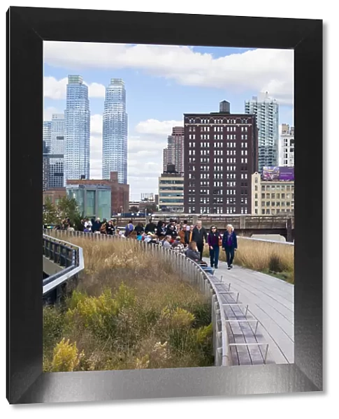 People walking on the High Line, a 1-mile New York City park on a section of former