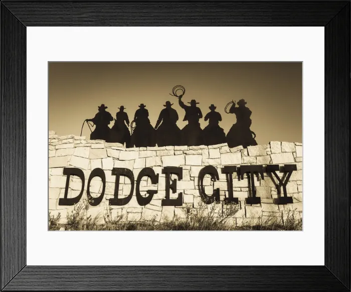 Framed Print : USA, Kansas, Dodge City, city sign with cowboy silhouettes Framed Print : USA, Kansas, Dodge City, city sign with cowboy silhouettes