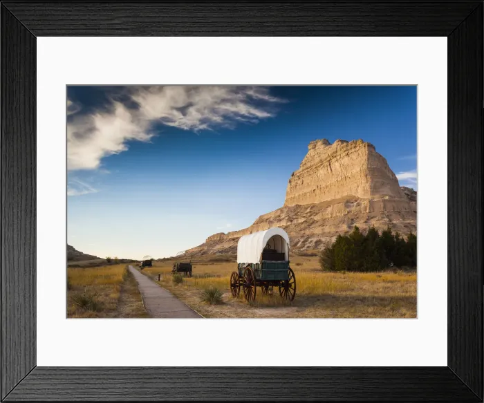 Framed Print : USA, Nebraska, Scottsbluff, Scotts Bluff National Monument and pioneer wagon train Framed Print : USA, Nebraska, Scottsbluff, Scotts Bluff National Monument and pioneer wagon train