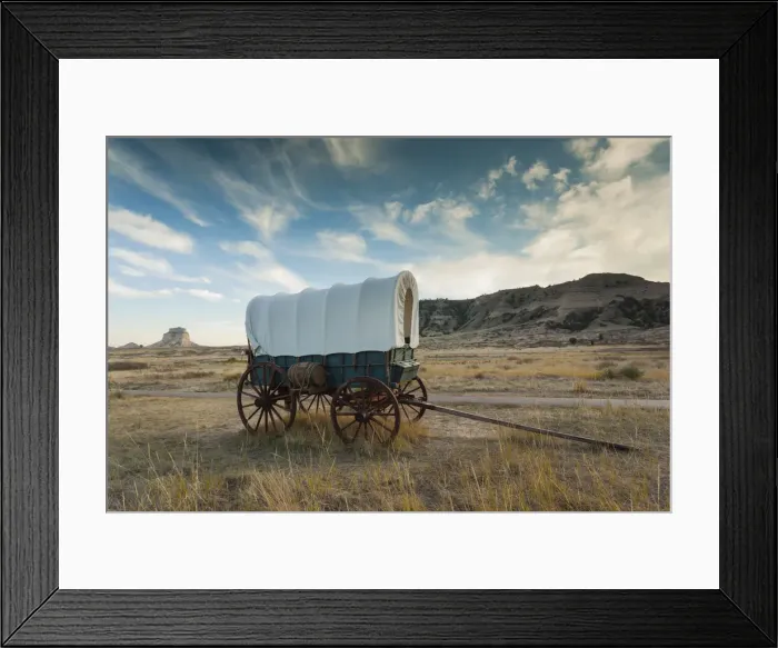 Framed Print : USA, Nebraska, Scottsbluff, Scotts Bluff National Monument and pioneer wagon train Framed Print : USA, Nebraska, Scottsbluff, Scotts Bluff National Monument and pioneer wagon train