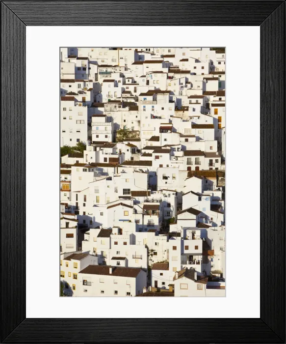 Framed Print : Jigsaw like house exteriors in the charming hilltop village of Casares, Malaga Province Framed Print : Jigsaw like house exteriors in the charming hilltop village of Casares, Malaga Province
