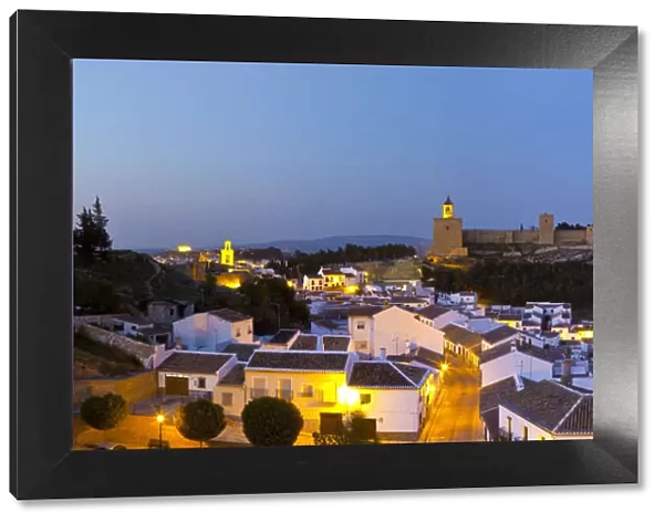 Moorish Alcazaba (castle) & city overview illuminated at dusk, Antequera, Malaga Province