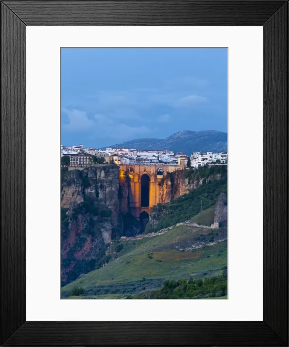 Framed Print : Elevated view over Puento Nuevo & the White Village of Ronda illuminated at dusk, Ronda Framed Print : Elevated view over Puento Nuevo & the White Village of Ronda illuminated at dusk, Ronda