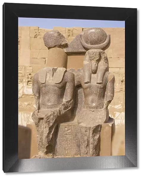 Egypt, Luxor, West Bank, The temple of Ramesses 111 at Medinet Habu, Two statues in