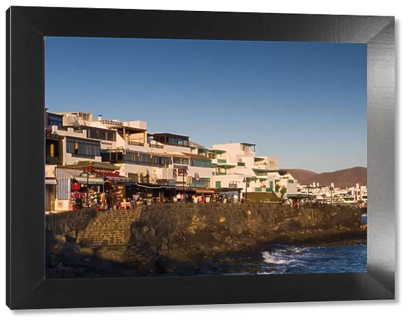 Spain, Canary Islands, Lanzarote, Playa Blanco, seafront view, dusk