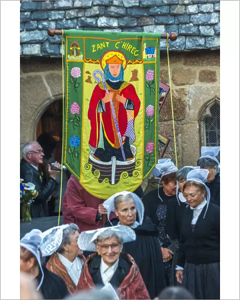 Breton ladies outside church in traditional dress for ceremony of Saint Guirec, Ploumanach