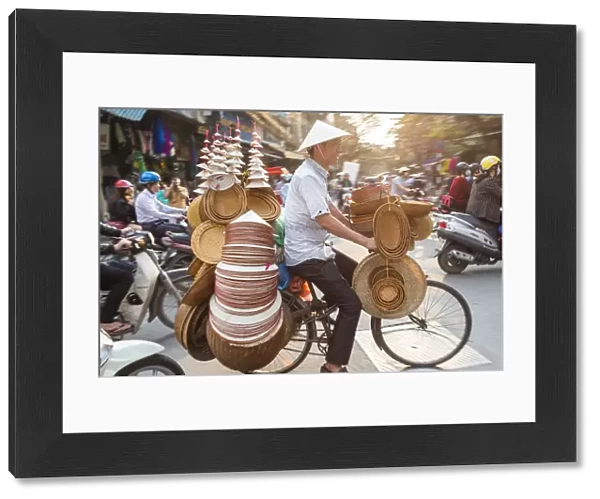 Basket & hat seller on bicycle, Hanoi, Vietnam