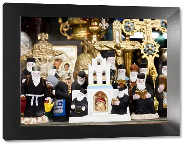 Greek Orthodox priest models & other orthodox icons in shop front, Athens, Greece