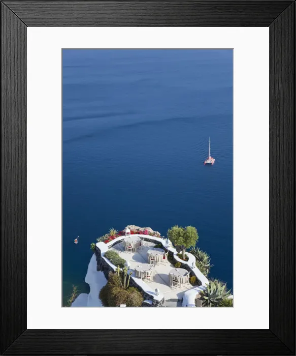 Framed Print : Outdoor dining area, Oia, Santorini, Cyclades islands, Greece