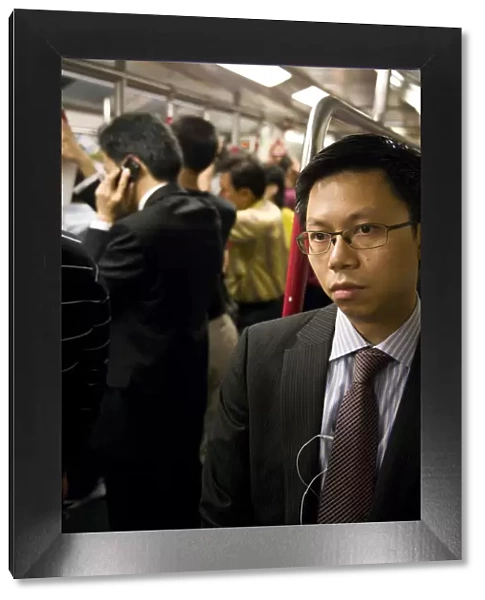 China, Hong Kong, commuters inside a busy Metro train