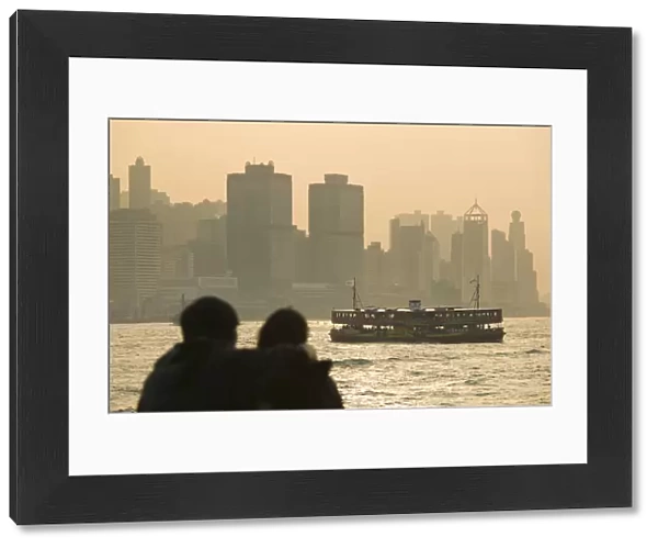 China, Hong Kong, Kowloon, Couple silhouette with Star Ferry