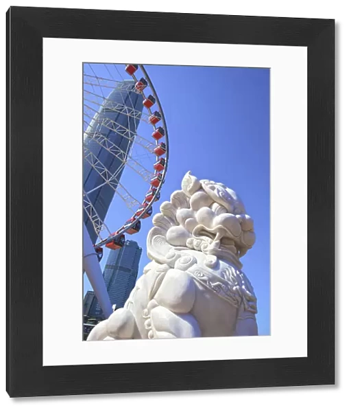 Chinese Guardian Lion In Front Of The Hong Kong Observation Wheel And The International