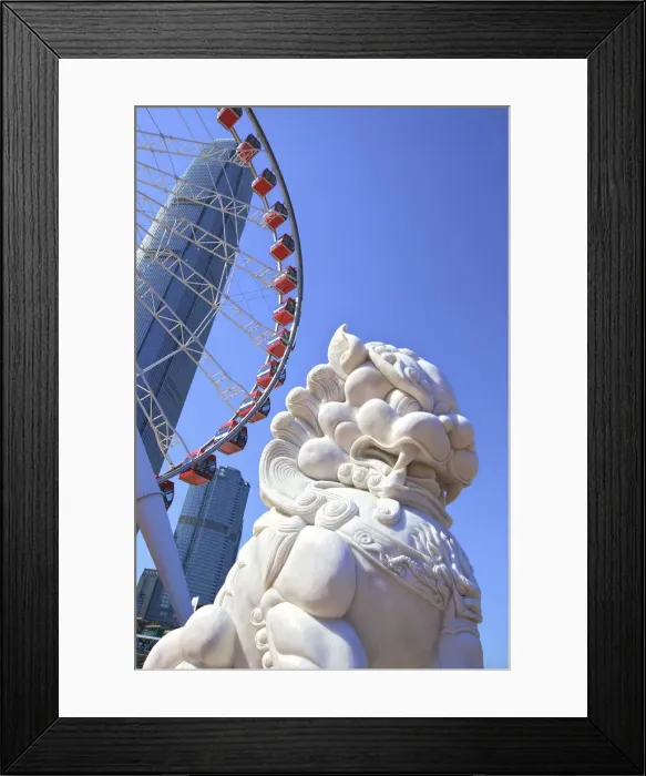 Framed Print : Chinese Guardian Lion In Front Of The Hong Kong Observation Wheel And The International Framed Print : Chinese Guardian Lion In Front Of The Hong Kong Observation Wheel And The International