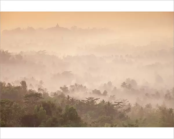 Indonesia, Java, Magelang, Mist hovering over Borobudur Temple at dawn