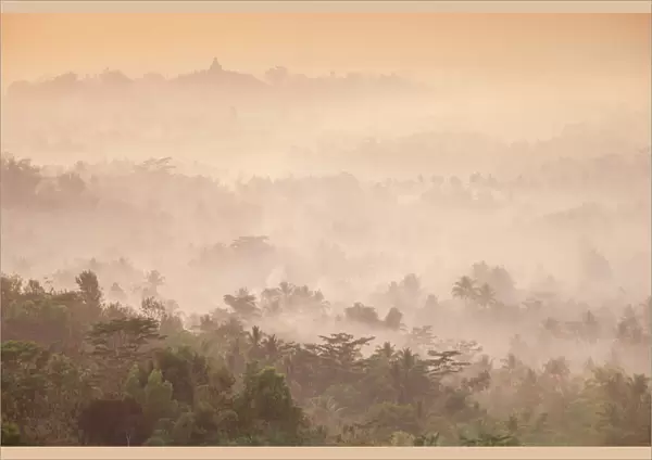 Indonesia, Java, Magelang, Mist hovering over Borobudur Temple at dawn