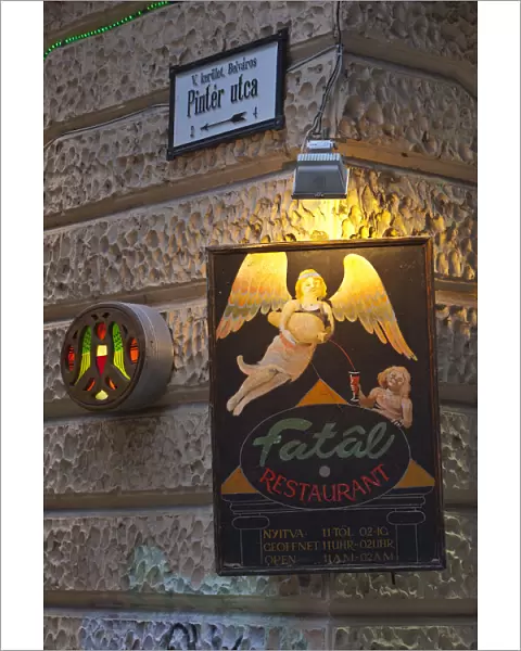 A sign advertises the Fatal Restaurant, a famous eating establishment, Pecs, Hungary