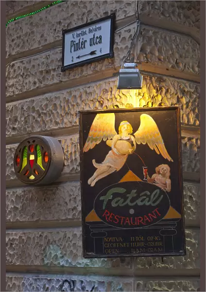 A sign advertises the Fatal Restaurant, a famous eating establishment, Pecs, Hungary