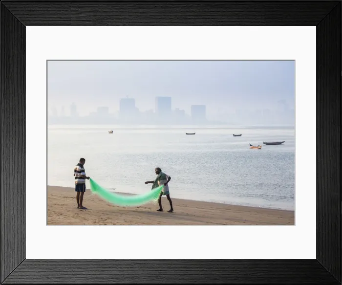 Framed Print : India, Maharashtra, Mumbai, Chowpatty, Men with fishing net on beach