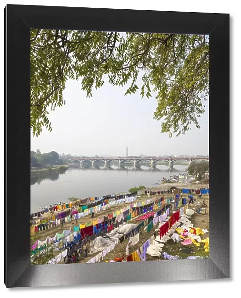 India, Uttar Pradesh, Lucknow, Washing drying on banks of Gomti River with