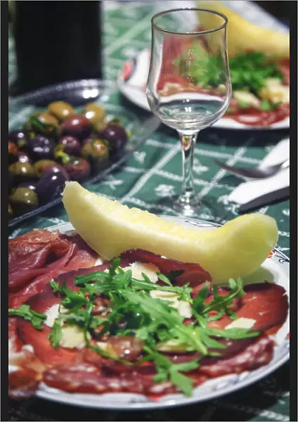 Italy, Naples, Traditional Antipasto with Prosciutto (Cured Ham) and Honeydew Melon