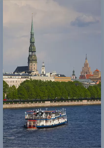 Latvia, Riga, Daugava River tourist boat and Riga skyline