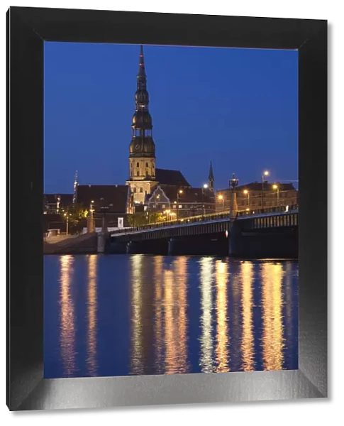 Latvia, Riga, Old Riga, St. Peters Lutheran Church and Akmens Bridge, evening