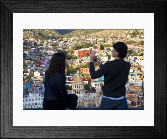 Framed Print : Couple taking picture over Guanajuato, Guanajuato state, Mexico Framed Print : Couple taking picture over Guanajuato, Guanajuato state, Mexico