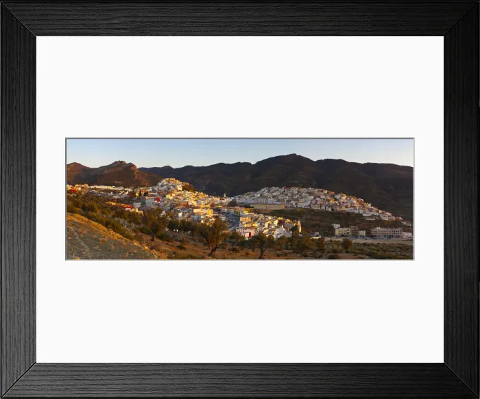 Framed Print : Elevated view over the historic hilltop town of Moulay Idriss illuminated at sunset Framed Print : Elevated view over the historic hilltop town of Moulay Idriss illuminated at sunset