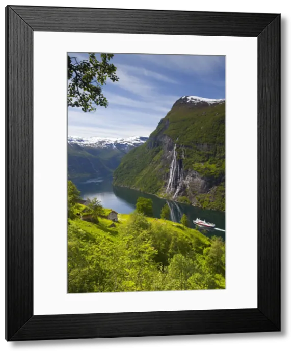 Framed Print : A car ferry passes beneath an old abandoned farm & the Seven Sisters waterfall, Geiranger Framed Print : A car ferry passes beneath an old abandoned farm & the Seven Sisters waterfall, Geiranger
