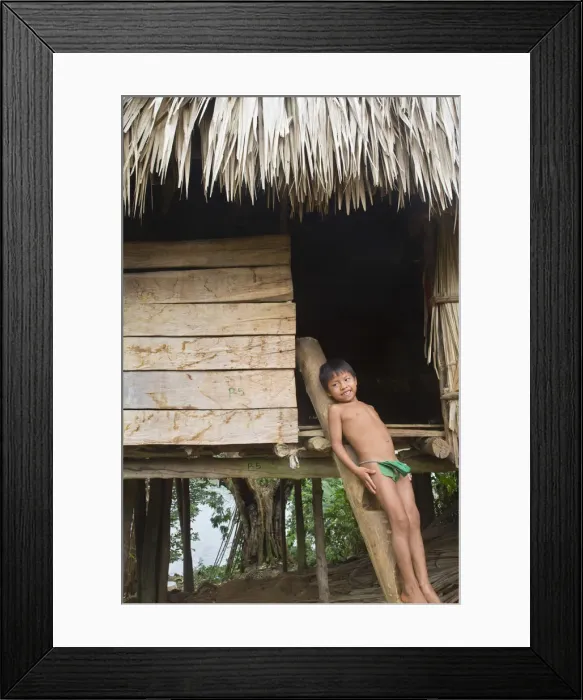 Framed Print : Panama, Chagres River, Embera Village, Embara boy leaning against traditional thatched Framed Print : Panama, Chagres River, Embera Village, Embara boy leaning against traditional thatched