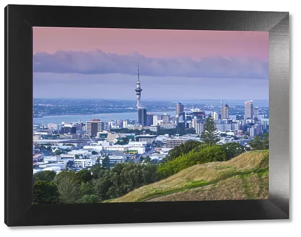 New Zealand, North Island, Auckland, elevated skyline from Mt. Eden volcano cone, dusk