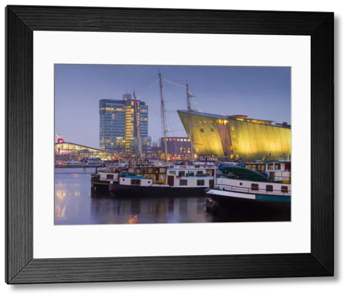 Framed Print : Netherlands, Amsterdam, Oosterdok area, NEMO science center buidling, dawn Framed Print : Netherlands, Amsterdam, Oosterdok area, NEMO science center buidling, dawn