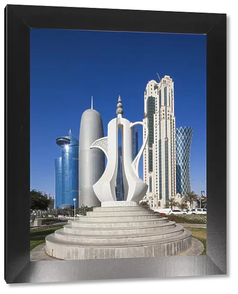 Qatar, Doha, Doha Bay, West Bay Skyscrapers, morning, with large coffeepot sculpture