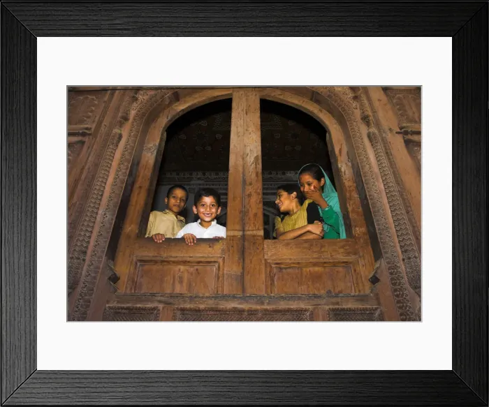 Framed Print : Pakistan, North West Frontier Province, Peshawar, Children looking out of windows Framed Print : Pakistan, North West Frontier Province, Peshawar, Children looking out of windows