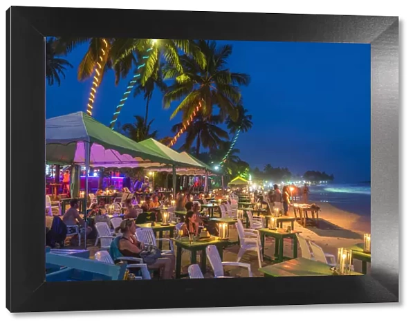 Restaurants on beach at dusk, Mirrisa, South Coast, Sri Lanka