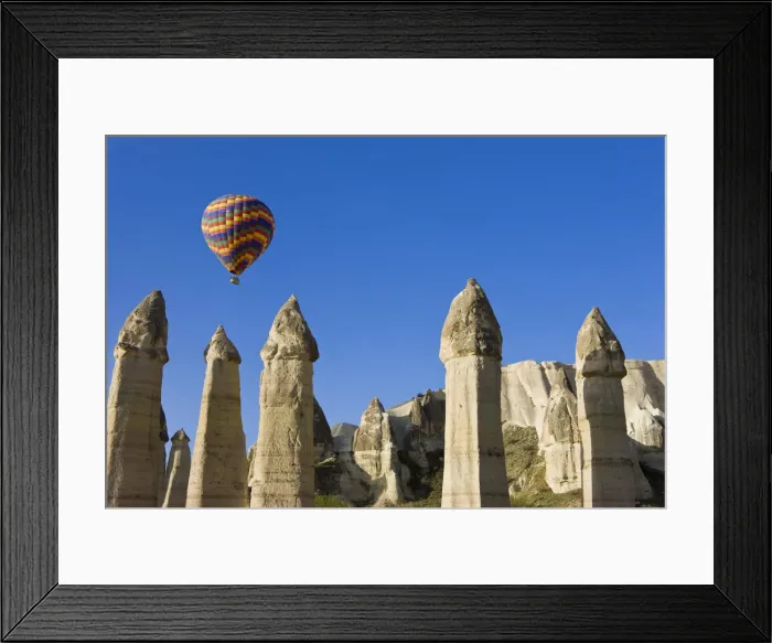 Framed Print : Hot Air balloon over the Phallic pillars (Fairy Chimneys), Love Valley, near Goreme Framed Print : Hot Air balloon over the Phallic pillars (Fairy Chimneys), Love Valley, near Goreme