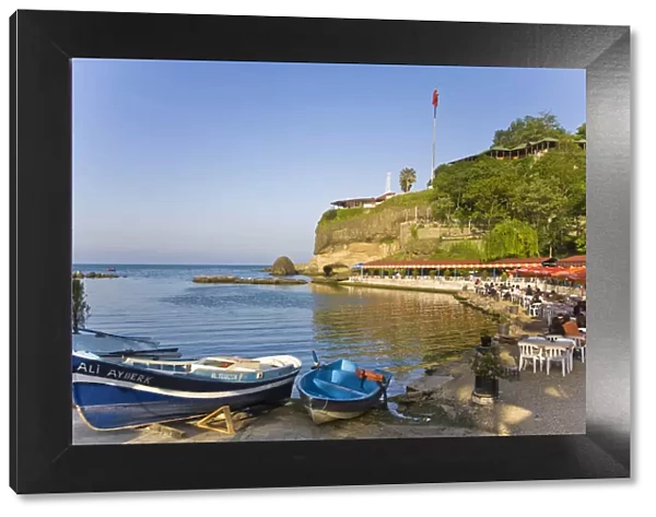 Turkey, Trabzon, Ocean front restaurant reflecting in Black sea