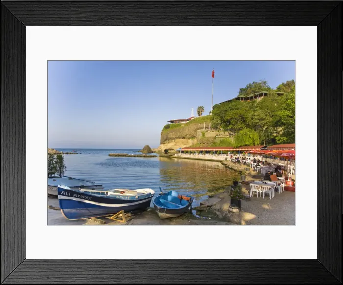 Framed Print : Turkey, Trabzon, Ocean front restaurant reflecting in Black sea