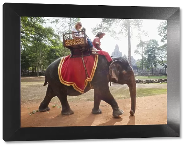 Cambodia, Siem Reap, Angkor Thom, Bayon Temple, Tourists on Elephant