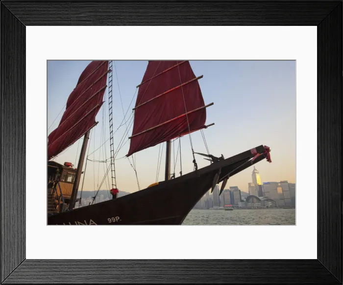 Framed Print : China, Hong Kong, Kowloon, Victoria Harbour, Junk Boat Sail and City Skyline in Background Framed Print : China, Hong Kong, Kowloon, Victoria Harbour, Junk Boat Sail and City Skyline in Background