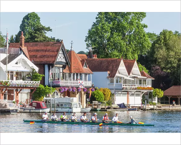 England, Oxfordshire, Henley-on-Thames, Boathouses and Rowers on River Thames