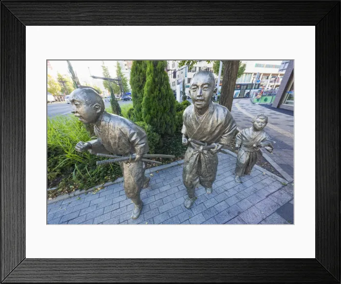 Framed Print : Japan, Kyushu, Kagoshima, Kagoshima City, Statues depicting Citizens Running to Framed Print : Japan, Kyushu, Kagoshima, Kagoshima City, Statues depicting Citizens Running to