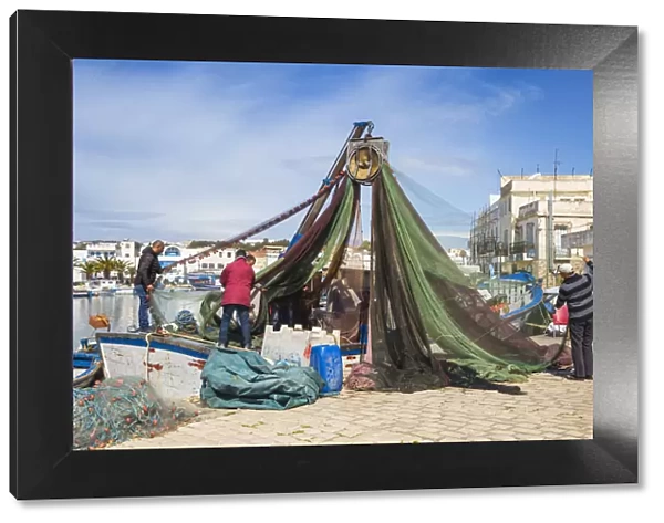 Tunisia, Bizerte, The Old Port, Fishermen examining nets