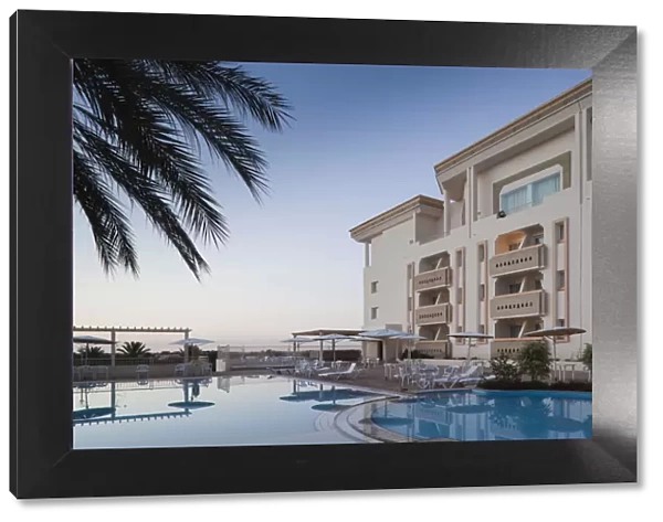 Tunisia, The Jerid Area, Tozeur, Hotel El Mouradi, swimming pool view, dawn