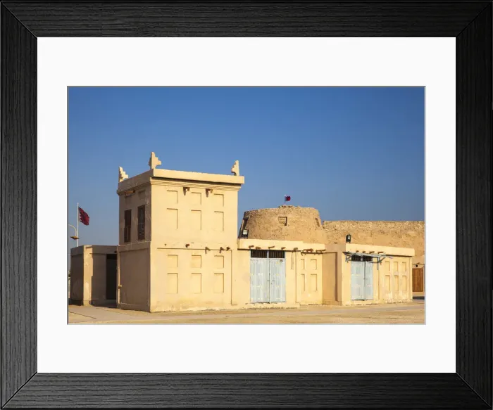 Framed Print : Bahrain, Manama, Arad Fort and traditional buildings with wind towers Framed Print : Bahrain, Manama, Arad Fort and traditional buildings with wind towers