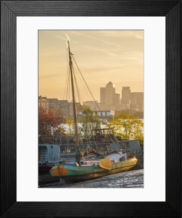 Framed Print : UK, England, London, Southwark, Canary Wharf skyline and old barges on River Thames Framed Print : UK, England, London, Southwark, Canary Wharf skyline and old barges on River Thames