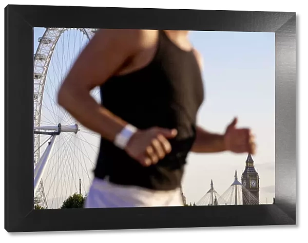 England, London, Westminster, Man jogging with The London Eye & Big Ban