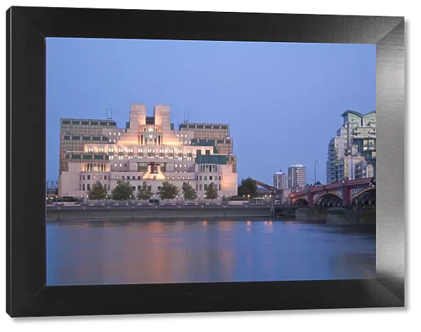 England, London, Vauxhall, MI6 Building reflecting in Thames river