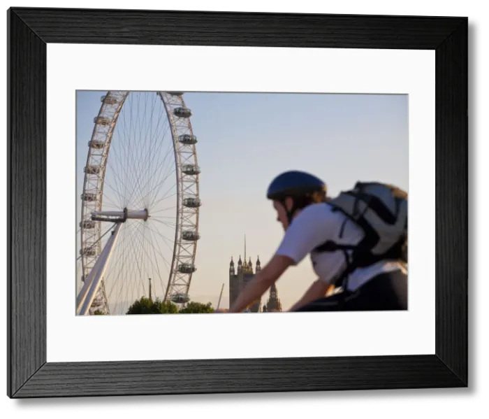 Framed Print : England, London, Westminster, Man cycling with The London Eye & The Houses of Parliament Framed Print : England, London, Westminster, Man cycling with The London Eye & The Houses of Parliament