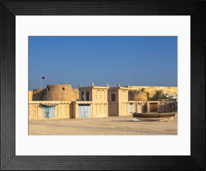 Framed Print : Bahrain, Manama, Arad Fort and traditional buildings with wind towers Framed Print : Bahrain, Manama, Arad Fort and traditional buildings with wind towers
